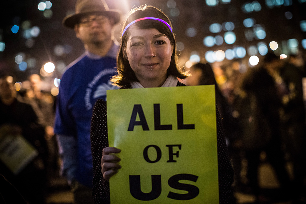 A woman attends a rally calling for greater social equality, organized by nonunionized fast food workers demanding a wage raise from $7.25 per hour to $15 per hour and to be unionized, December 2013, in New York. (Getty/Andrew Burton)