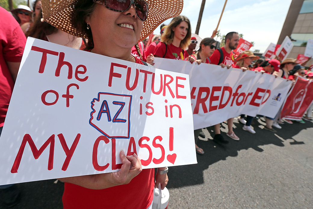 Arizona teachers march toward the state Capitol as part of a rally for the #REDforED movement on April 26, 2018, in Phoenix. (Getty/Ralph Freso)
