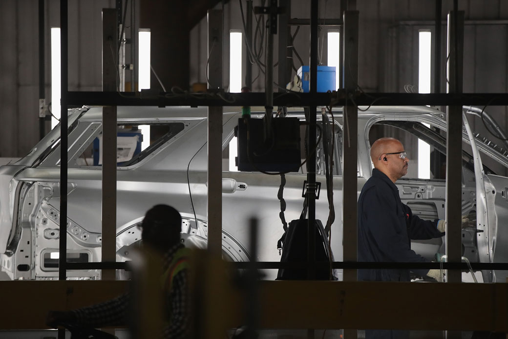 Workers assemble vehicles at an auto plant in Chicago, June 2019. (Getty/Scott Olson)