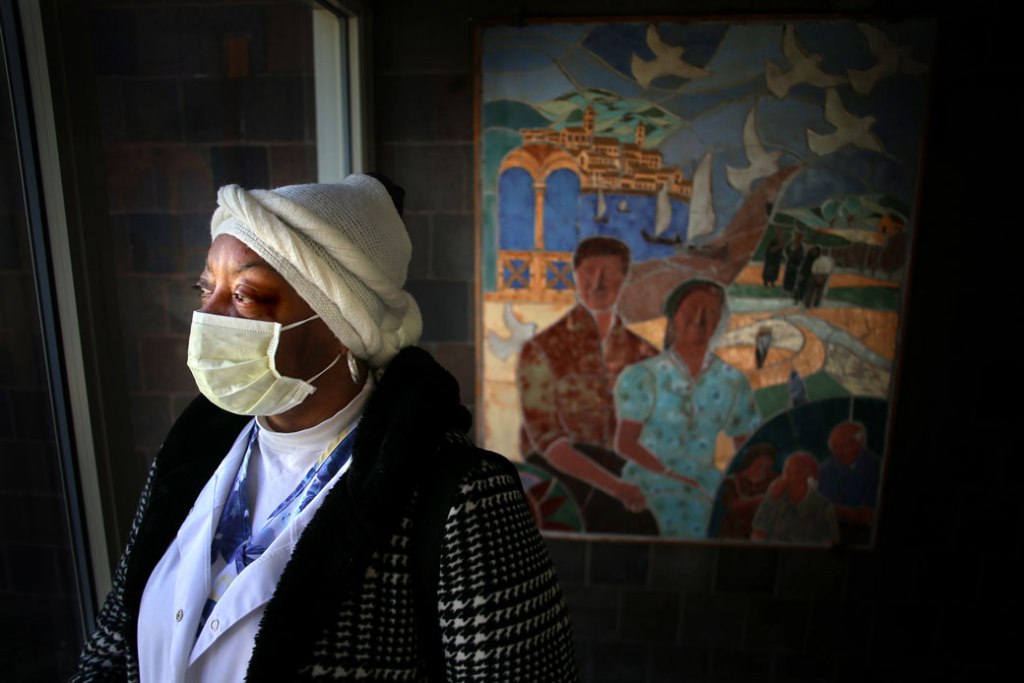 A home care worker leaves her home in Cambridge, Massachusetts, to care for an elderly woman in Watertown on March 26, 2020. (Getty/The Boston Globe/Lane Turner)