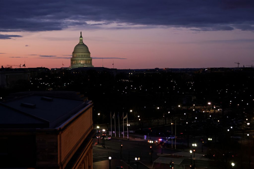 The sun rises behind the U.S. Capitol on January 17, 2021, in Washington, D.C. (Getty/Samuel Corum)