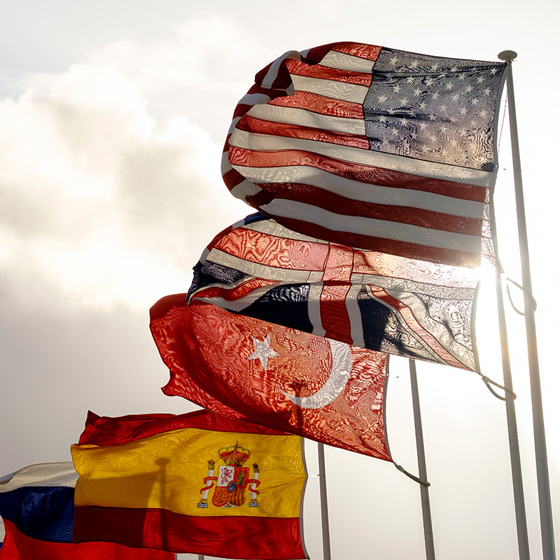 U.S. and other national flags fly outside NATO headquarters in Brussels.