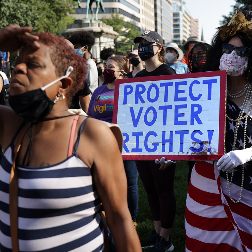 A voting rights activist dresses as 