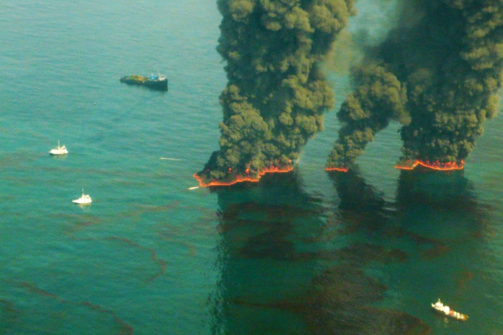 Smoke rises from a controlled burn after the BP oil spill, May 19, 2010, in the Gulf of Mexico. (Getty/U.S. Coast Guard/John Kepsimelis)