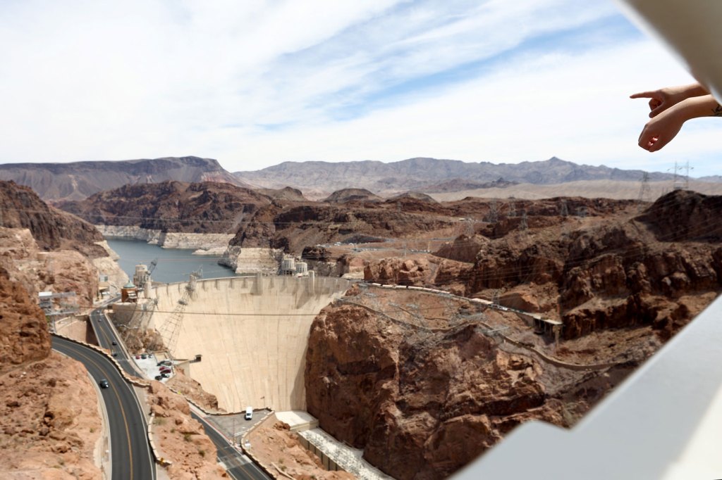 People view Lake Mead and the Hoover Dam from the Nevada side of the Mike O'Callaghan-Pat Tillman Memorial Bridge in the Lake Mead National Recreation Area, Nevada.