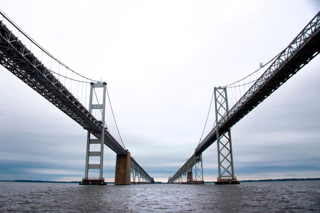 Photo shows a large dual-span bridge from below.