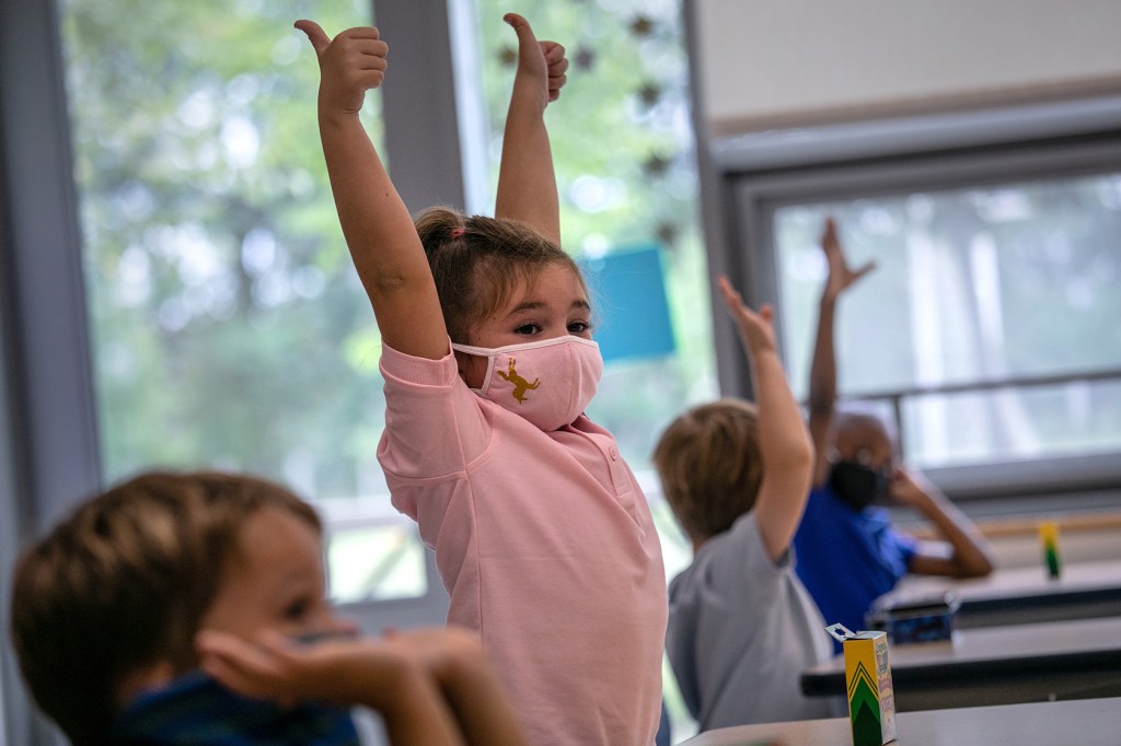 Child raising hands