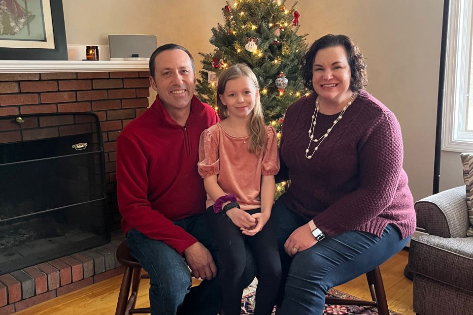 Margaret Langsenkamp, right, sits with her husband, Lee, and daughter, Louelle, in December 2021. (Photo credit: Margaret Langsenkamp) 