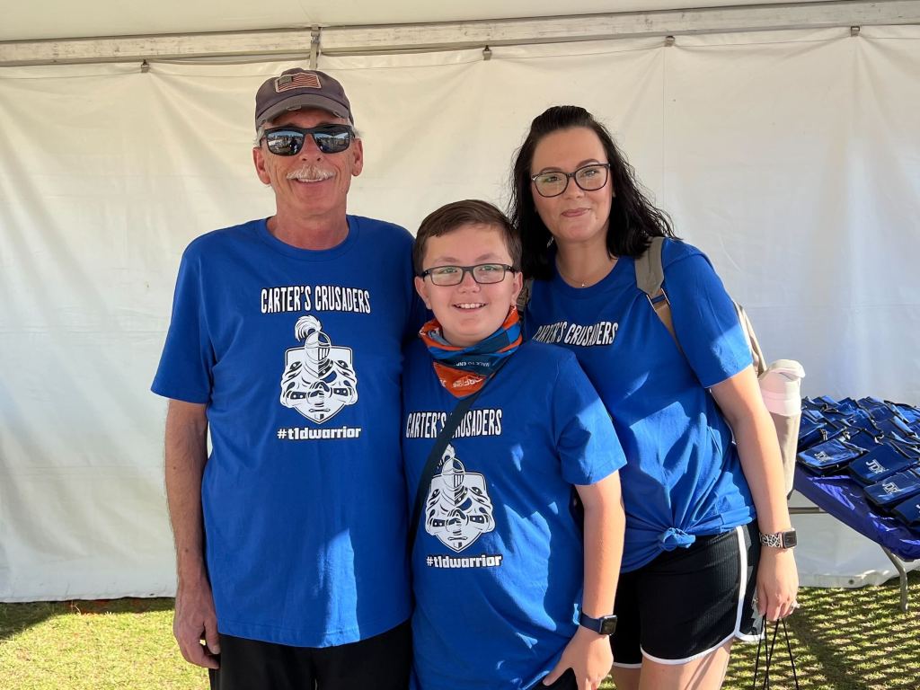 Jennifer Schuerman is pictured with her husband, Todd, and son, Carter.