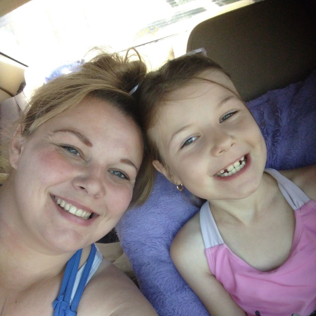 Nikki Wall poses for a photo with her daughter Emma.