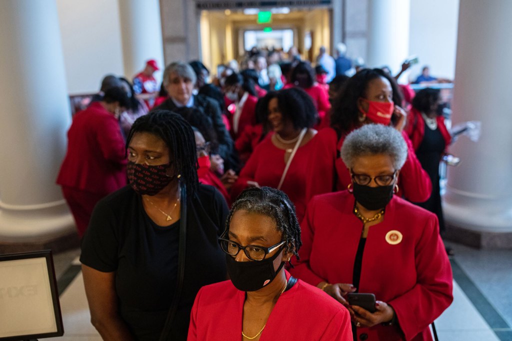 People stand in line to testify before the House Select Committee on Constitutional Rights and Remedies, which began hearings on bail reform and election integrity bills.