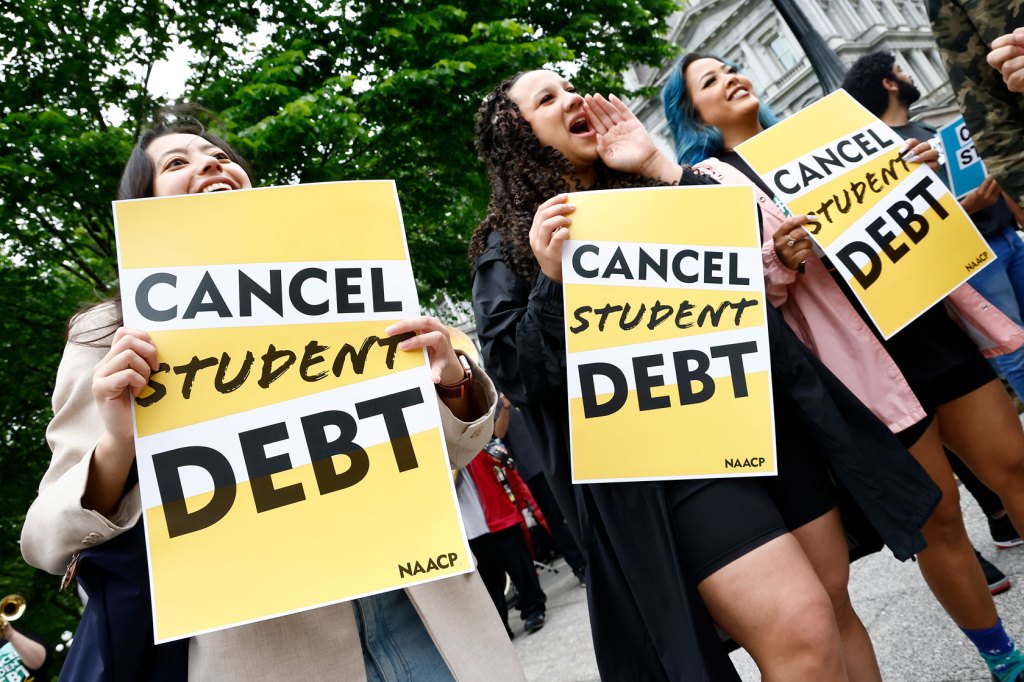 Three borrowers holding signs that say Cancel Student Debt