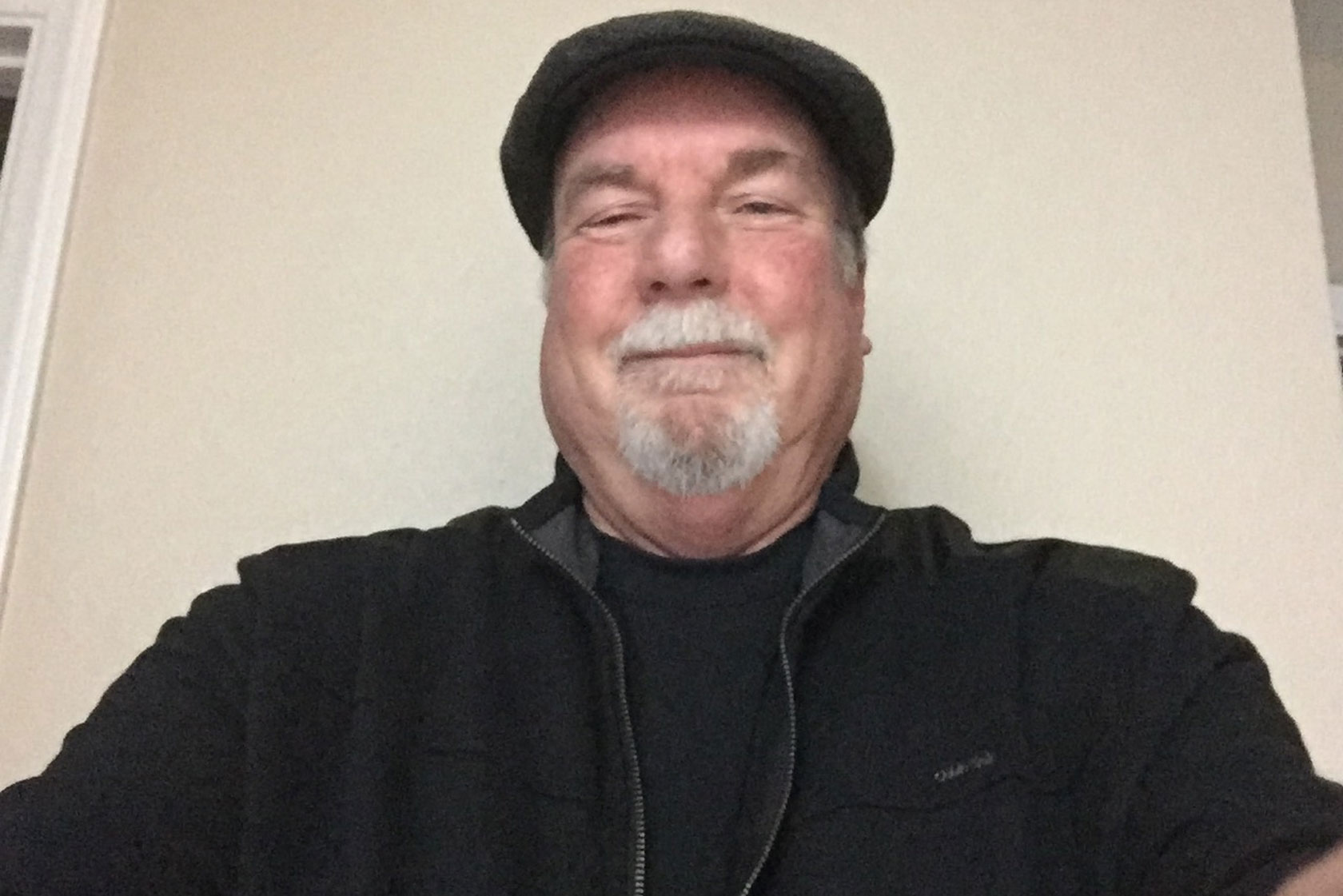 Rick Buchanan wears a newspaper cap for a selfie.