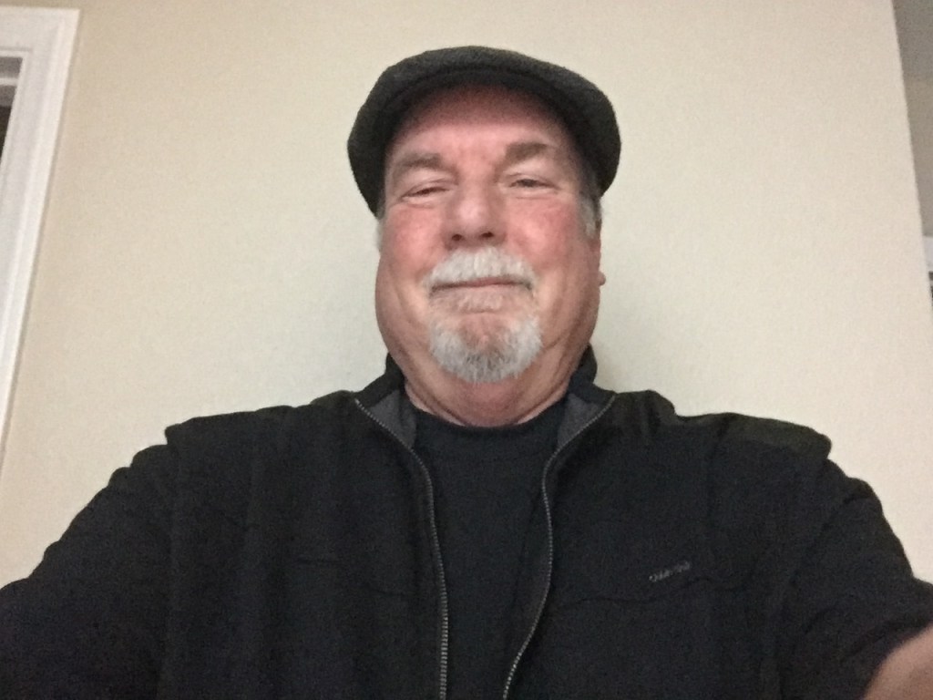 Rick Buchanan wears a newspaper cap for a selfie.