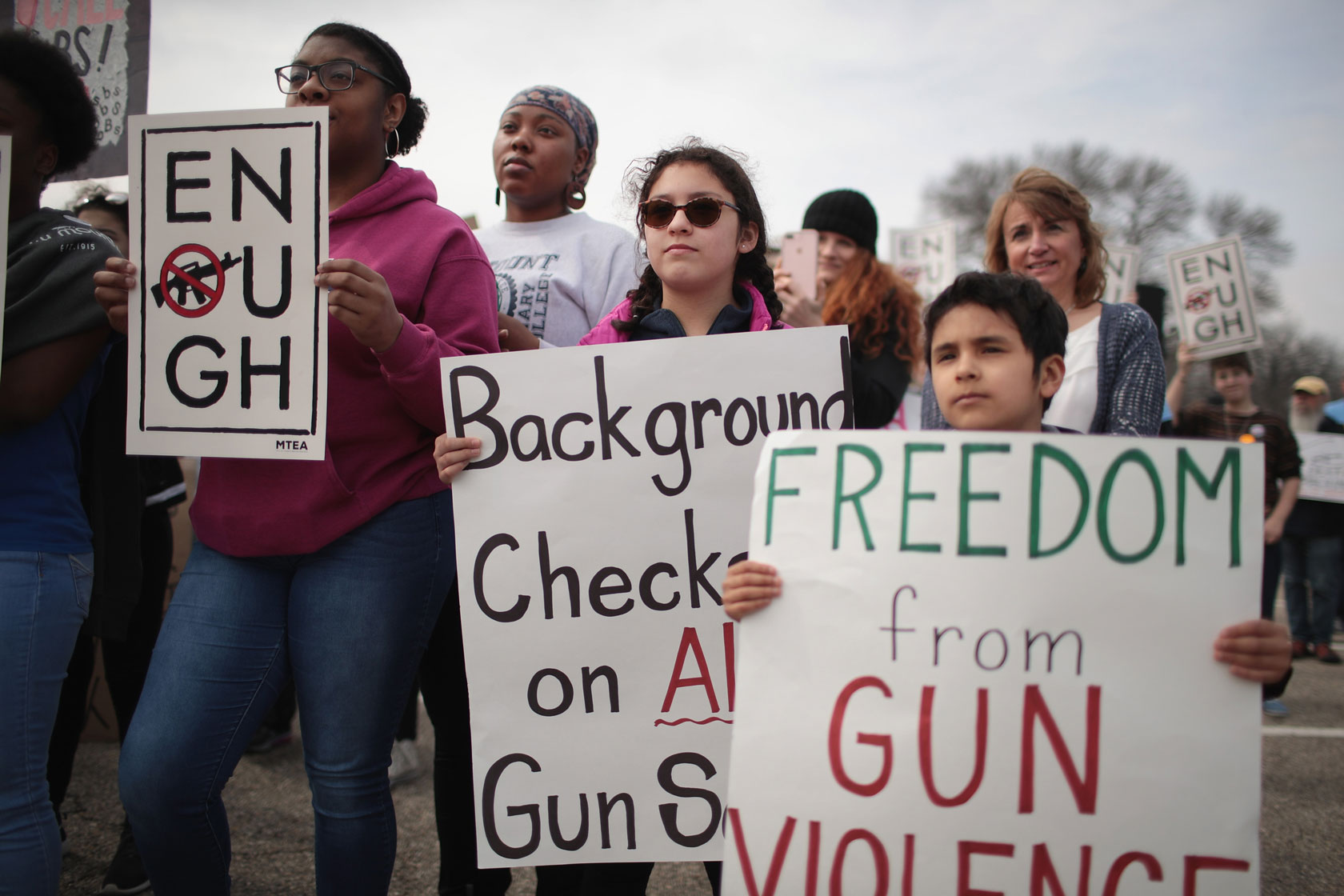 People join a rally in Janesville, Wisconsin, to show support for students who finished the last leg of a 50-mile journey calling attention to gun violence.