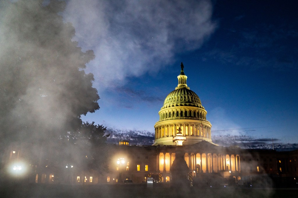 Capitol dome with dark sky and steam