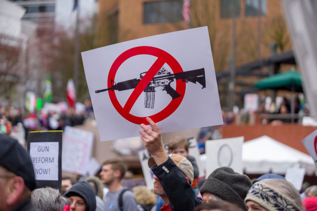 A demonstrator's sign is seen during the