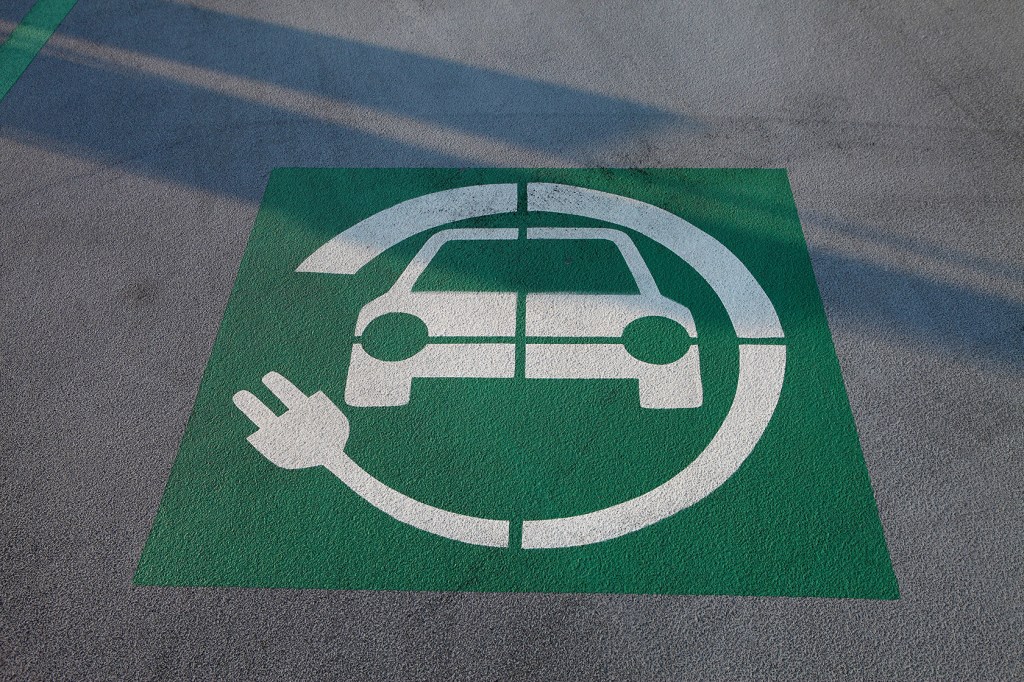 Electric vehicle charging symbol on pavement