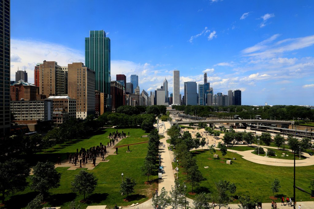 A large park is seen before the Chicago city skyline.