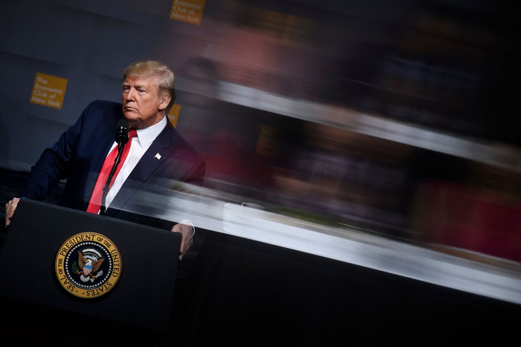 Then-U.S. President Donald Trump pauses while speaking at the Economic Club of New York.