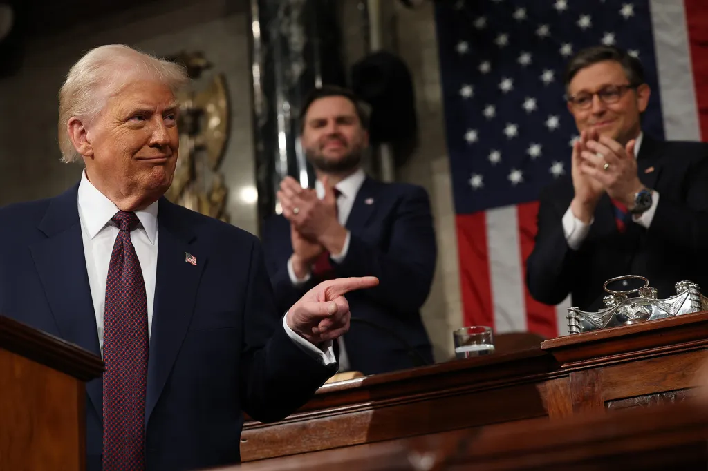 U.S. Vice President JD Vance and Speaker of the House Mike Johnson (R-LA) applaud as U.S. President Donald Trump addresses a joint session of Congress.